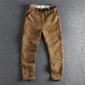 Men's cotton work trousers with N I buckle belt in dark blue colour showing three-dimensional cutting construction