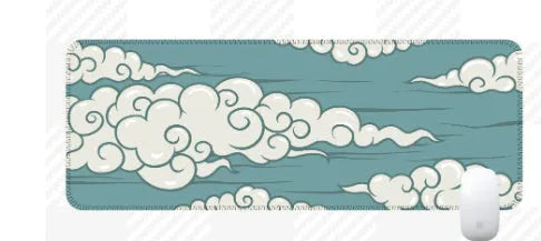 Large Japanese-style cloud pattern desk mat on a wooden office desk with keyboard and mouse.