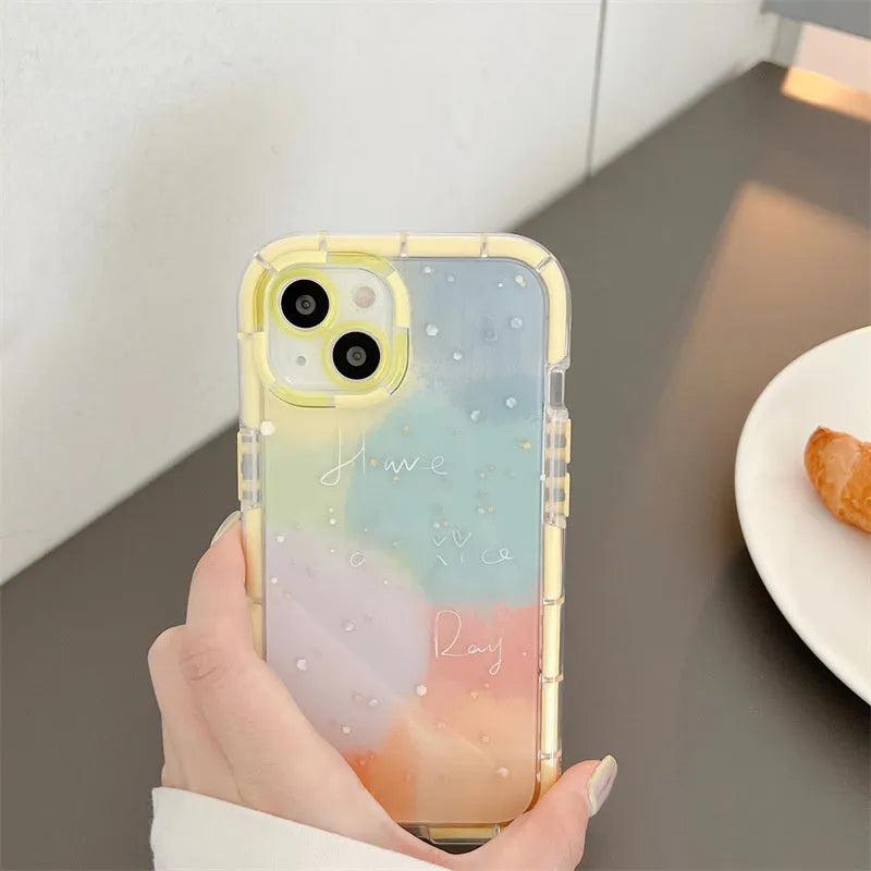 Slim minimalist silicone iPhone case with a yellow edge trim on a table.