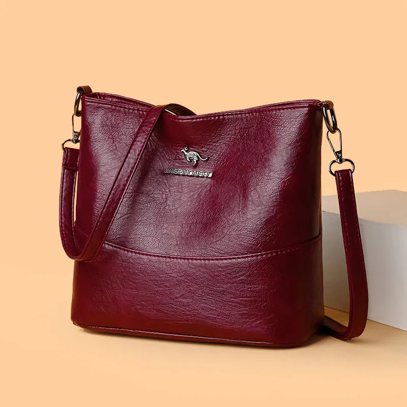 Women's soft leather shoulder bag in bucket design with large capacity and internal phone pocket