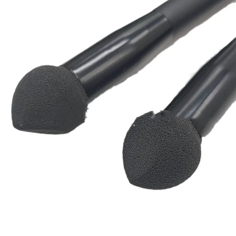 Black concealer brush with wooden handle and sponge stick tip for under-eye application