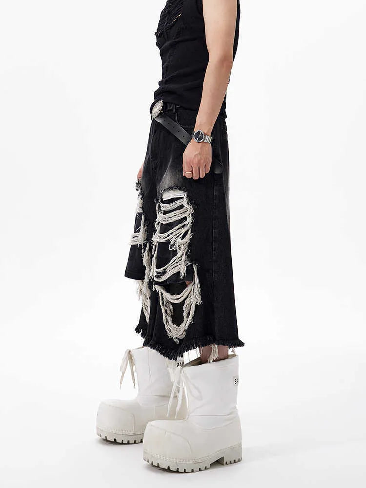 Black women's cropped wide-leg jeans with ripped patch details on a mid-high waist.