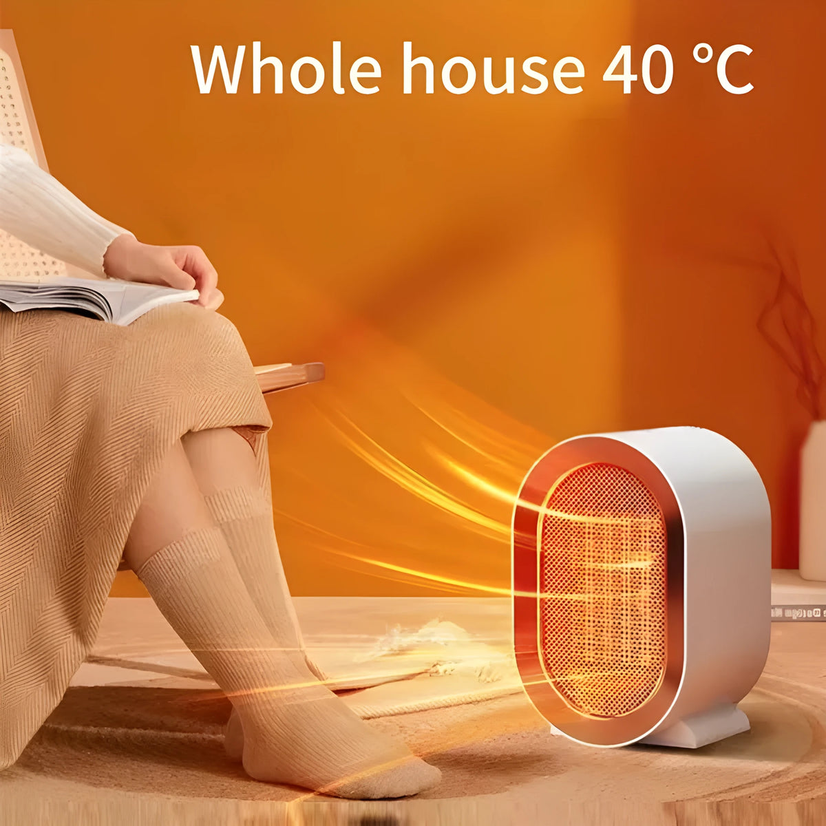 Compact desktop electric fan heater in black with mechanical control dial.