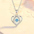 Blue diamond electroplated heart necklace and bracelet set with gem inlay on a geometric pendant.