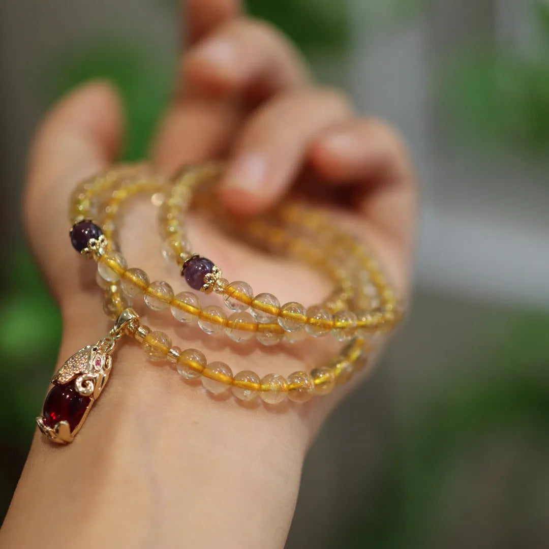 Natural Brazil gold rutilated quartz bracelet with Chinese style design and ruby quartz hanging chopsticks