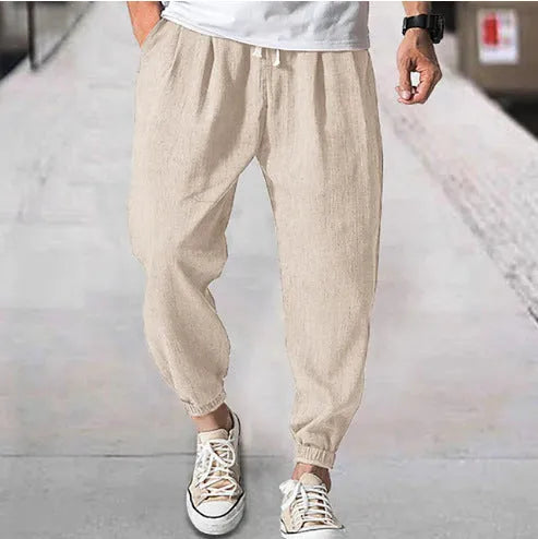Men's loose cotton casual trousers with elasticated ankle bands in light green