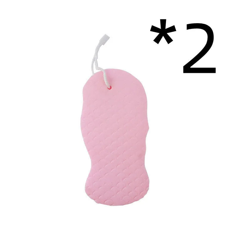 White 3D fish scale pattern bath sponge ball with hanging loop on a grey background.