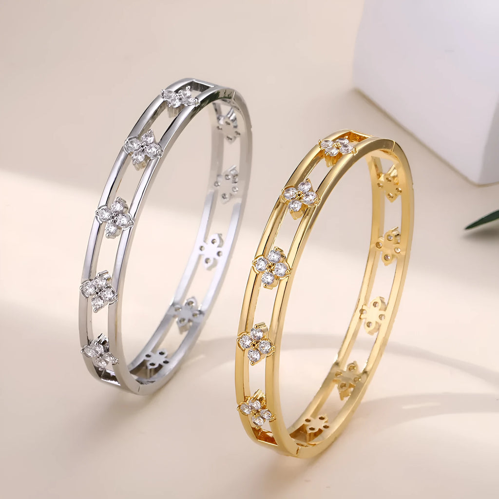 Women's hollow bracelet with four-leaf clover design and zircon stones in gold or silver
