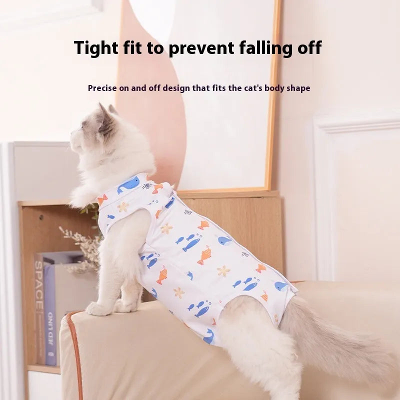 Cat wearing a blue patterned post-surgery sterilization recovery suit with Velcro closures.