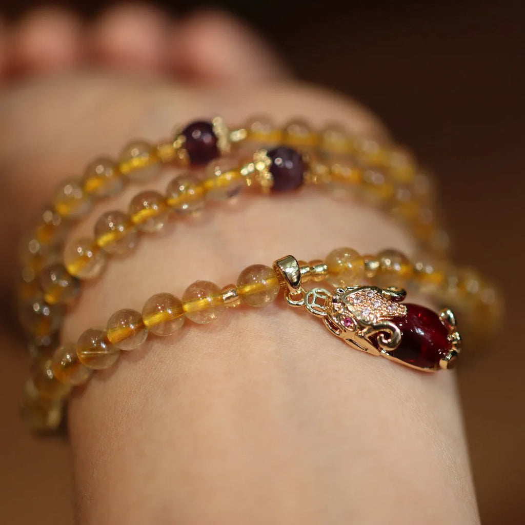 Natural Brazil gold rutilated quartz bracelet with Chinese style design and ruby quartz hanging chopsticks