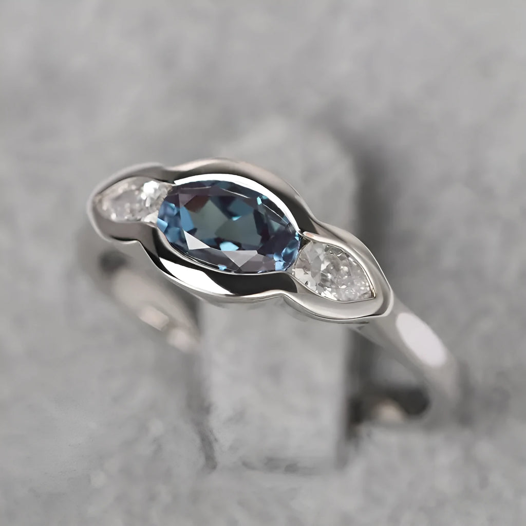 Women's geometric ellipse ring in white gold finish with inlaid zircon stones on copper