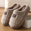 Men's grey and brown plaid winter slippers with a thick sole and artificial wool lining.