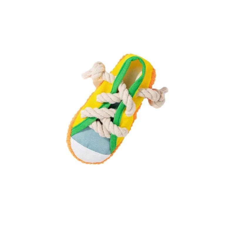 Slipper-shaped plastic dog chew toy with squeaker in three colour options
