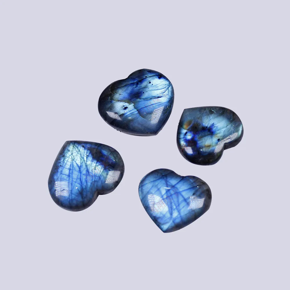 Natural pulled feldspar heart handle pendant in ocean blue moonlight colour on a white background.