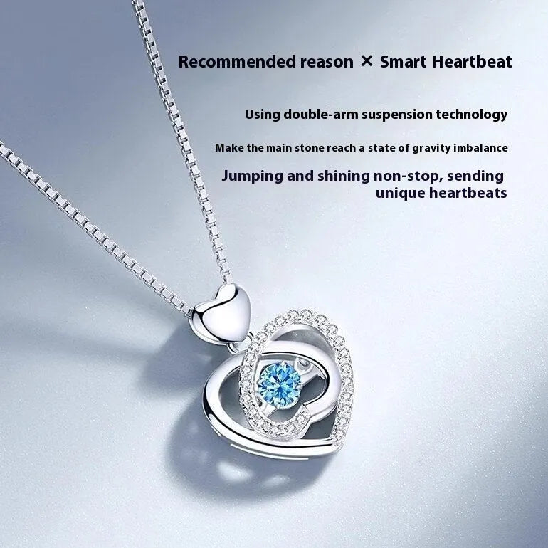 Blue diamond electroplated heart necklace and bracelet set with gem inlay on a geometric pendant.