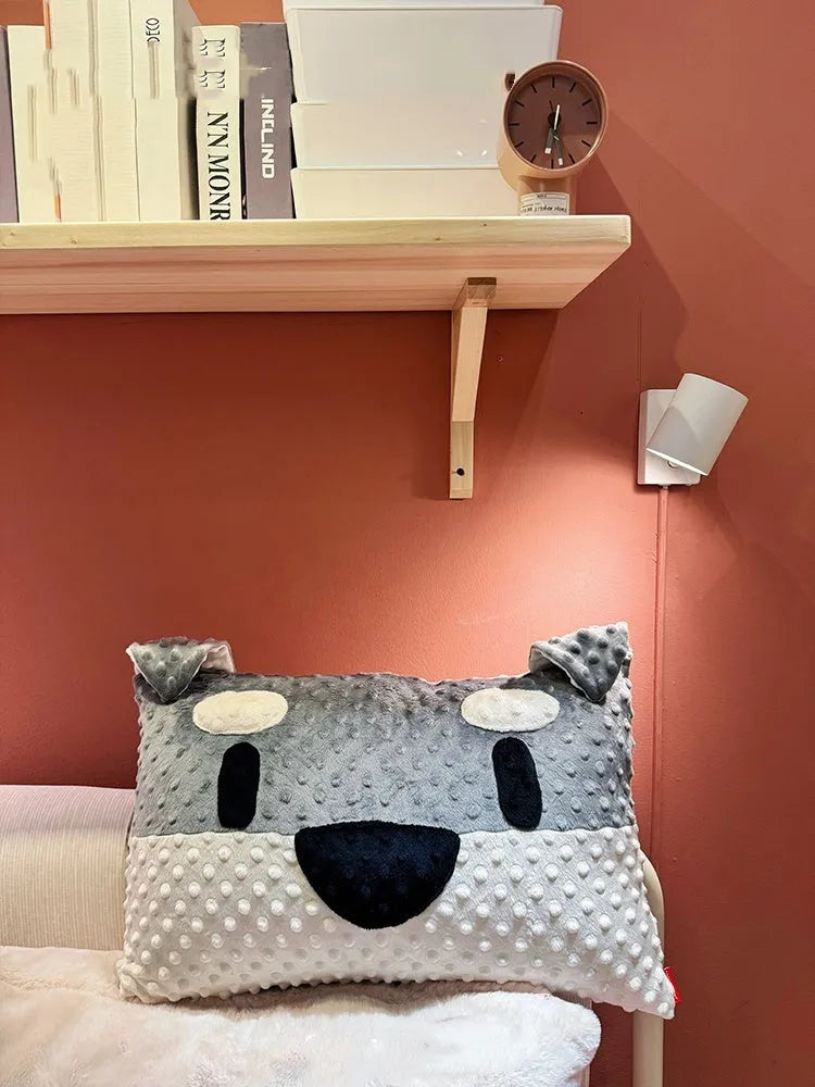 Grey and white West Highland puppy decorative cushion on sofa