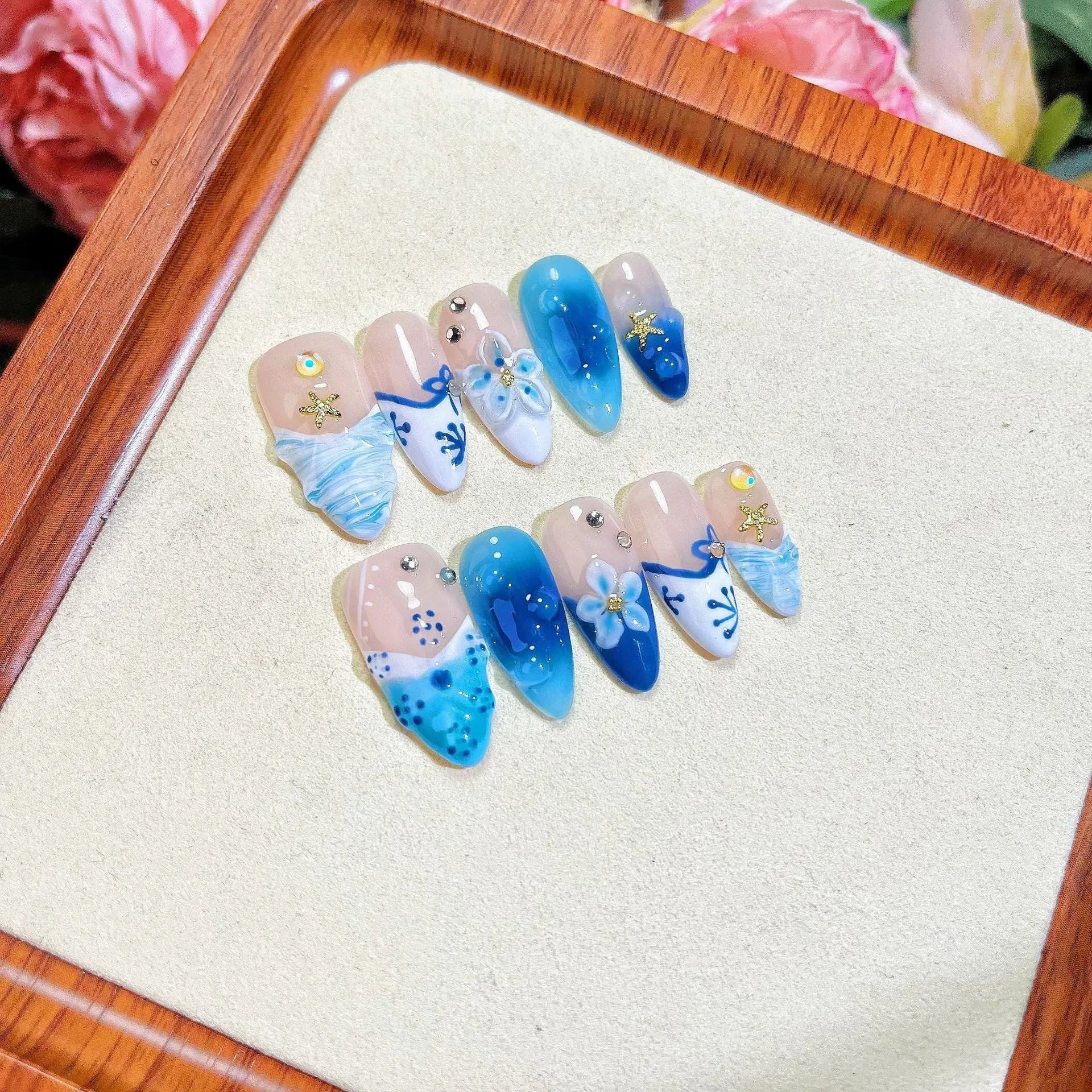 Blue hand-painted carved summer ice transparent plastic fake nails with decorative surface texture