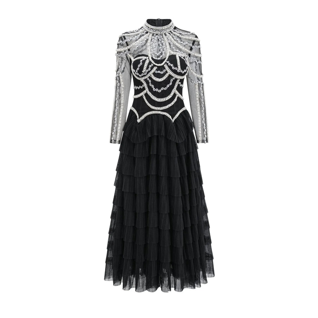 Women's black long sleeve beaded formal dress with mid waist and full-length skirt.