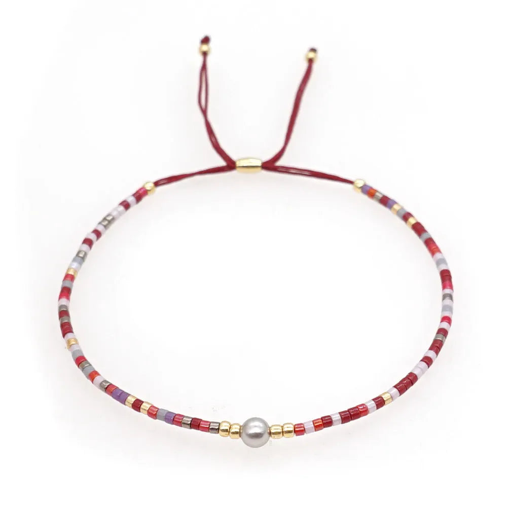 Handmade colourful bohemian bracelet with geometry beads in glass and coloured glaze