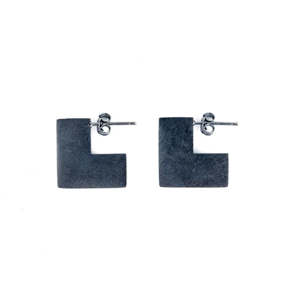 Oxidation black geometric square sterling silver earring ring on a 16mm scale.
