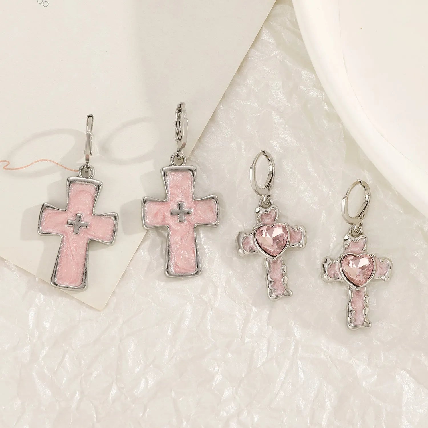Women's cross crystal earrings with dripping oil treatment in white, black, and silver colour variations