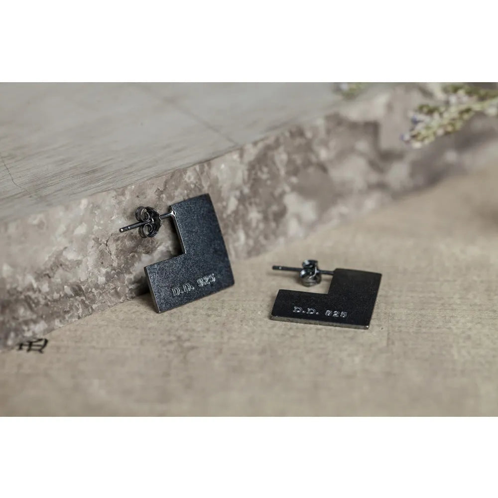 Oxidation black geometric square sterling silver earring ring on a 16mm scale.