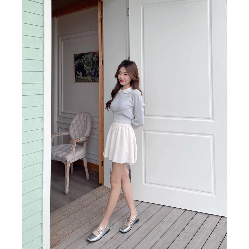 Women's silver genuine leather Mary Jane flats with a cross buckle strap and flat low heel.