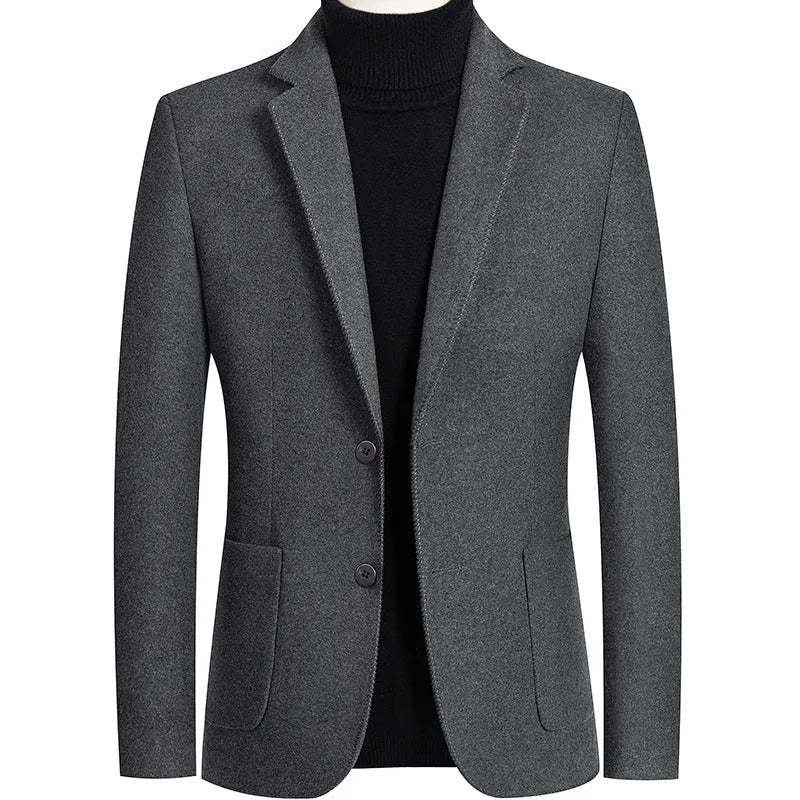 A man wearing a slim-fit grey wool blend suit jacket for autumn and winter leisure wear.