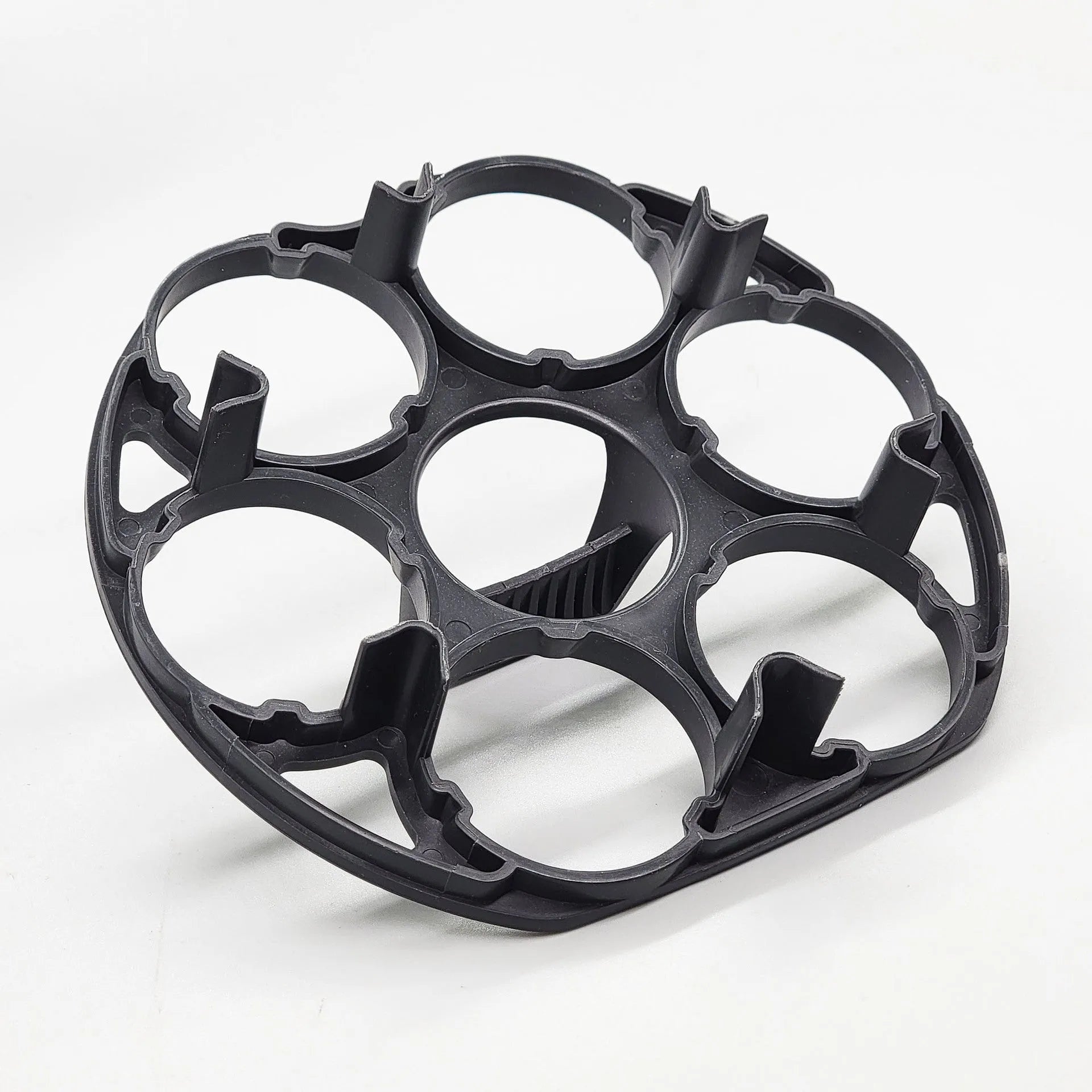 Black plastic egg holder rack with modern design for kitchen organisation.