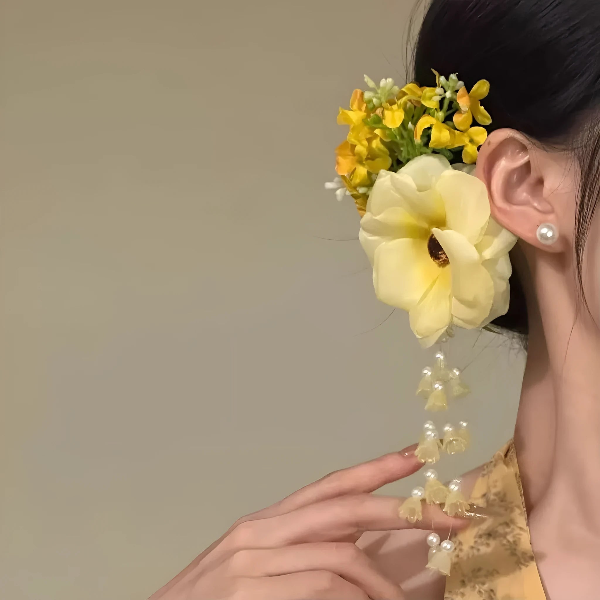 Yellow flower tassel side hair clip with manual craft details on white background