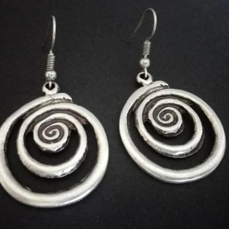 Silver alloy geometric spiral earrings with distressed finish measuring 2.6cm wide by 5cm long