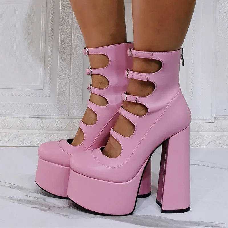 Women's black patent leather platform high heel boot with a serpentine strap and buckle closure.