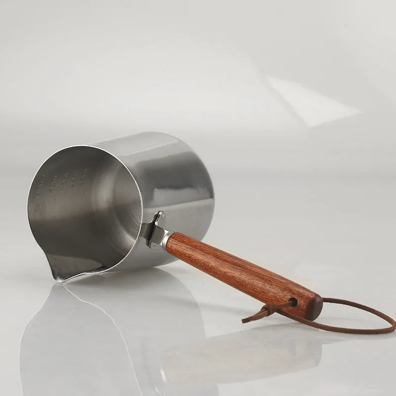 Stainless steel coffee cup with measurement scale and wooden handle in simple design