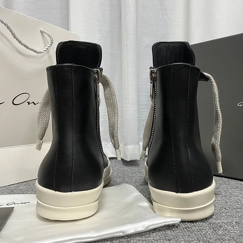 Men's black high-top leather sneakers with side zip, platform sole, and visible stitching details.