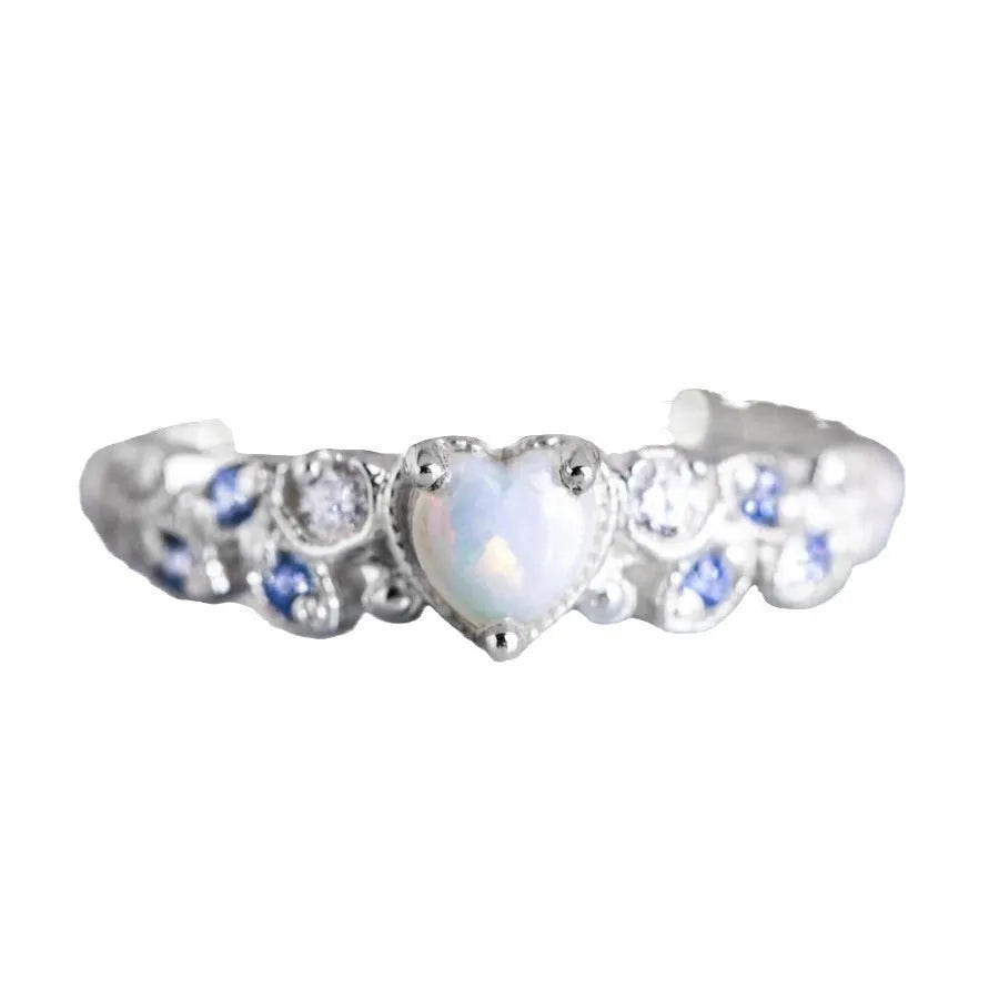 Peach-coloured alloy women's ring in a heart shape with floral and opal design details.