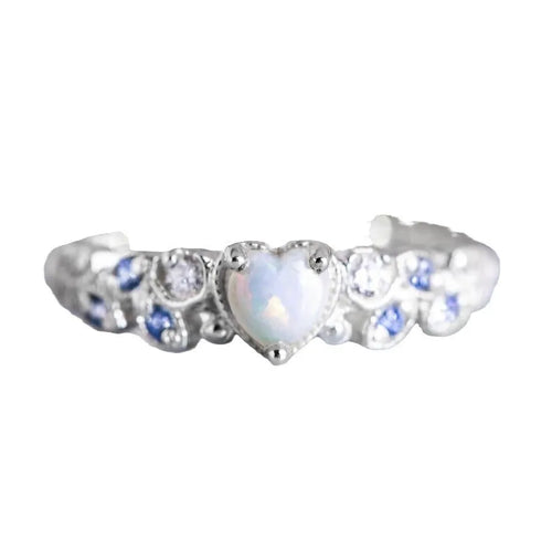Peach-coloured alloy women's ring in a heart shape with floral and opal design details.
