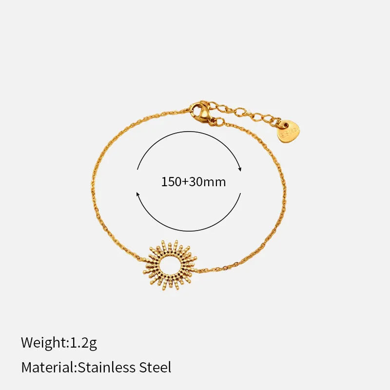 Gold tone geometric jewellery set with sun motif including necklace and bracelet for women