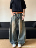 Men's retro blue distressed denim wide-leg trousers showing distressed detailing and wide-leg silhouette
