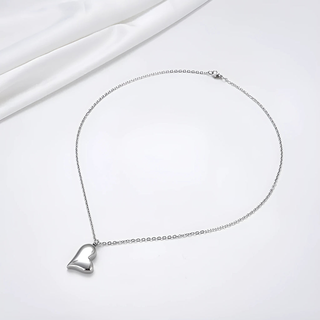 Curved peach heart stainless steel pendant necklace with silver electroplated finish