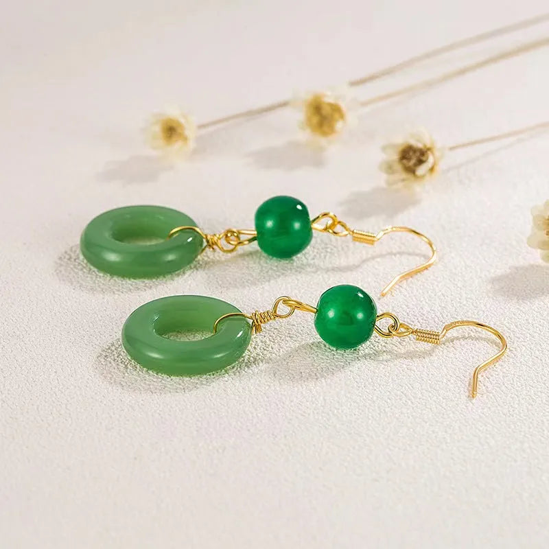 Green geometric peace buckle earrings with 14K gold plating on a zinc alloy base.