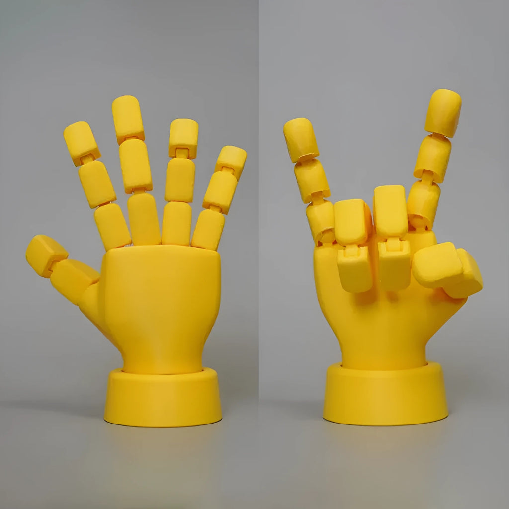 Yellow PLA hand ornament figurine with movable joint on a display surface.