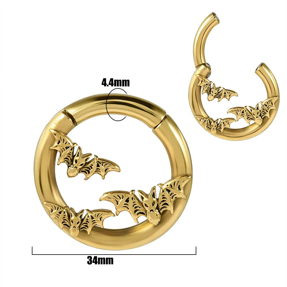 A pair of stainless steel fashion earrings with an intricate totem pattern design in a silver-toned finish.