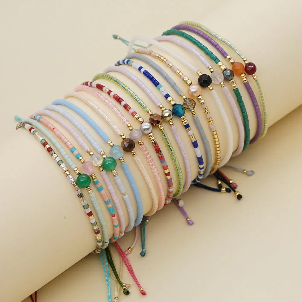 Handmade colourful bohemian bracelet with geometry beads in glass and coloured glaze