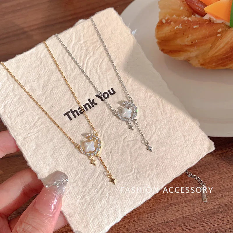 Women's gold necklace with star and moon pendant featuring zirconium crystal treatment
