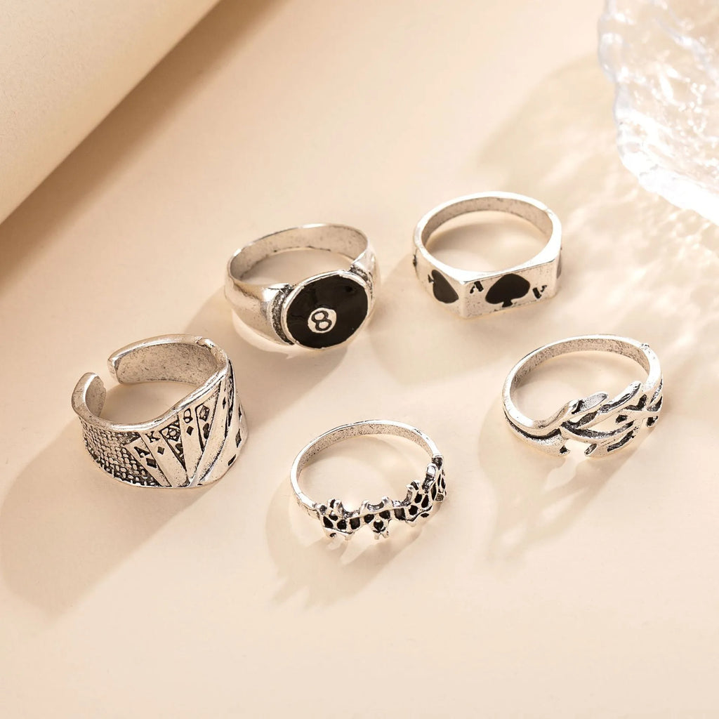Black alloy poker ring with retro spade design, adjustable sizing for women