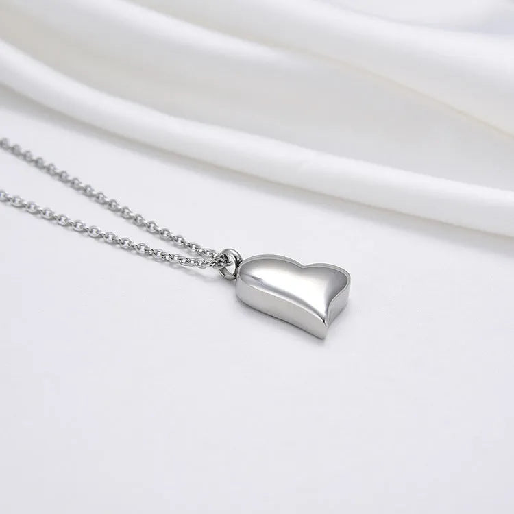 Curved peach heart stainless steel pendant necklace with silver electroplated finish