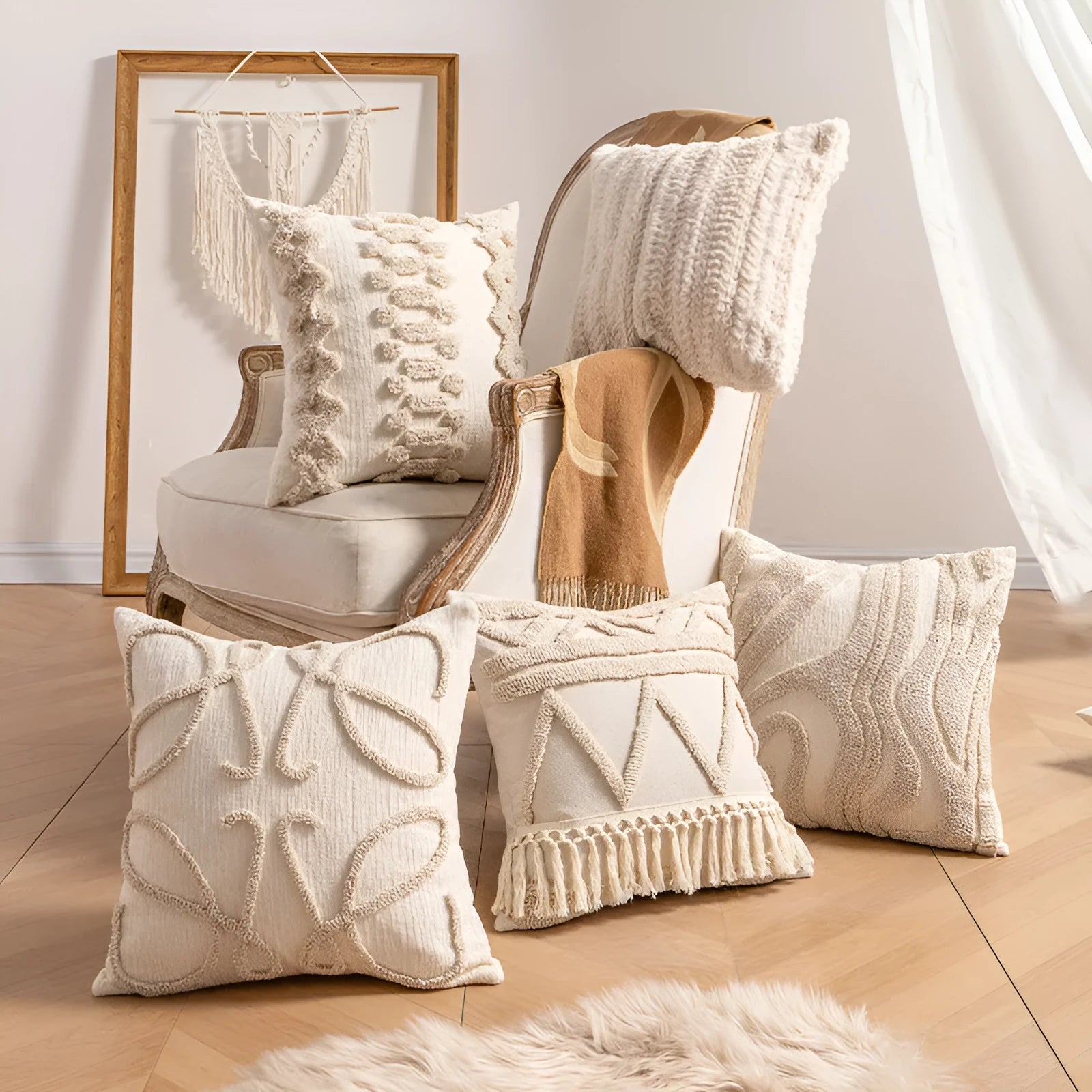 Knitted tassel pillow cover in striped pattern on a sofa.