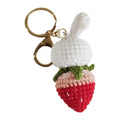 White hand-woven wire rabbit pendant with strawberry pattern and key