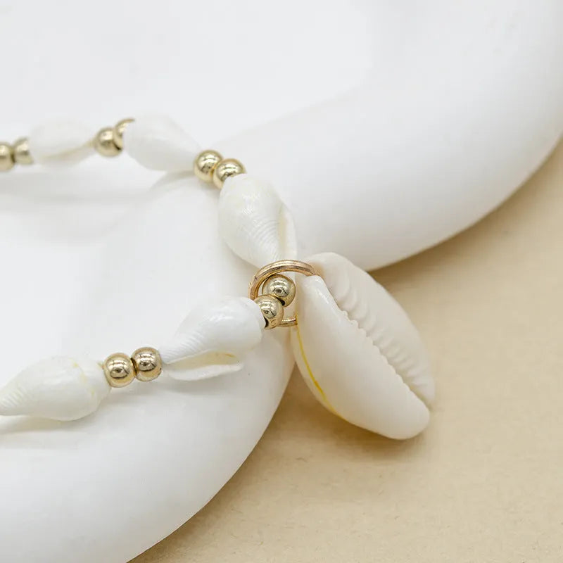 White conch shell necklace with mother-of-pearl pendant on regular chain