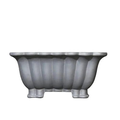 Square purple sand ceramic bonsai pot with warp device on a desktop.